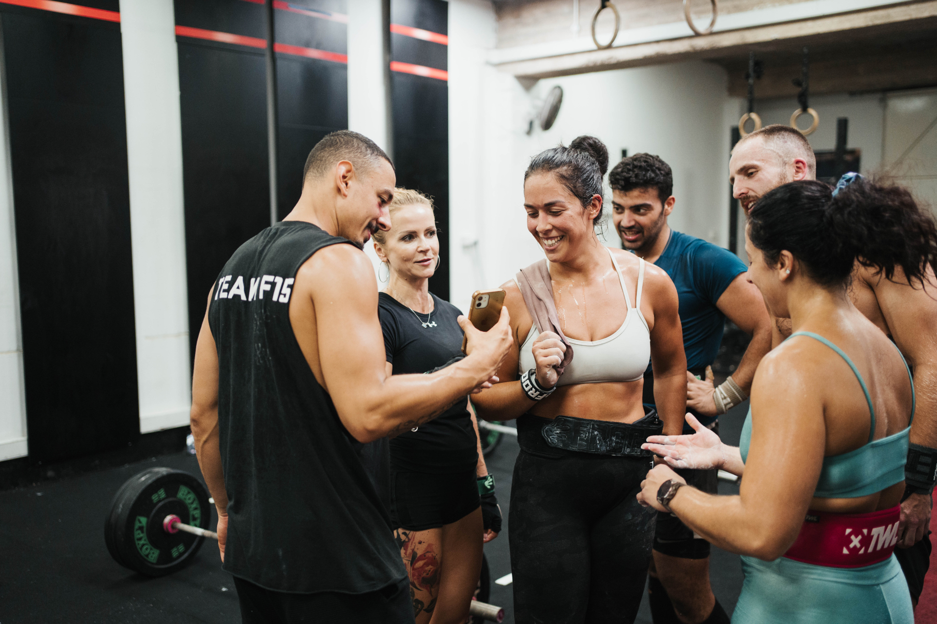 F15 Training Centr members celebrating together after a workout